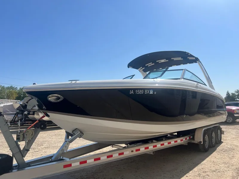 Slide: The Image of 2016 Cobalt R30 boat on trailer under clear blue sky. - 5