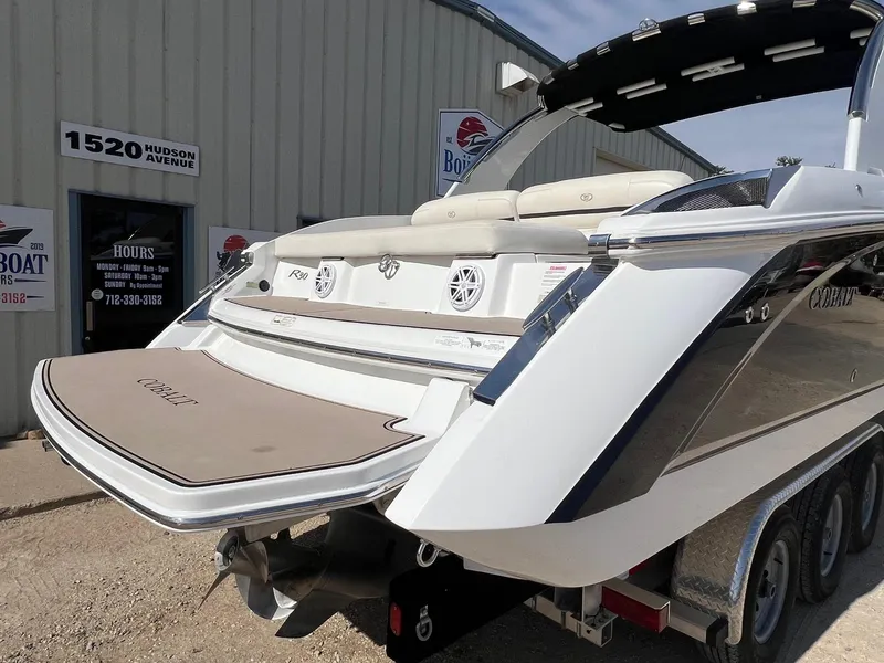 Slide: The Image of 2016 Cobalt R30 boat displayed outside dealership on trailer, showcasing sleek design and branding. - 8