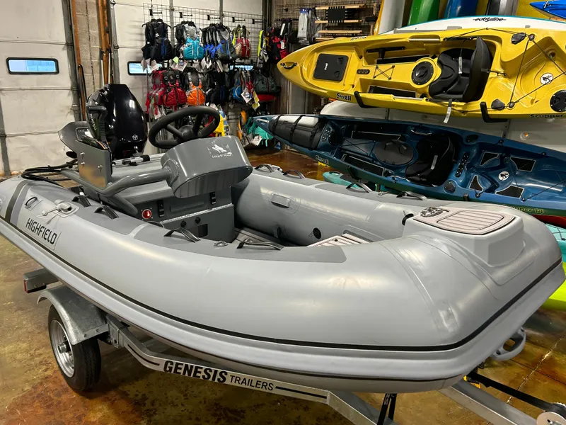 Slide: The Image of 2025 Highfield Classic 310 FCT inflatable boat on Genesis trailer in showroom. - 3