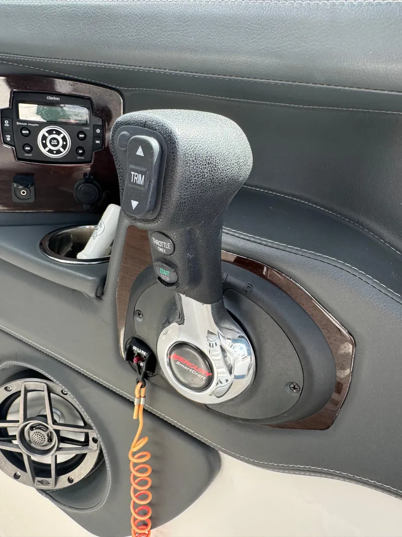 Slide: The Image of Throttle control panel of 2022 Chaparral 267 SSX OB boat with audio system. - 14