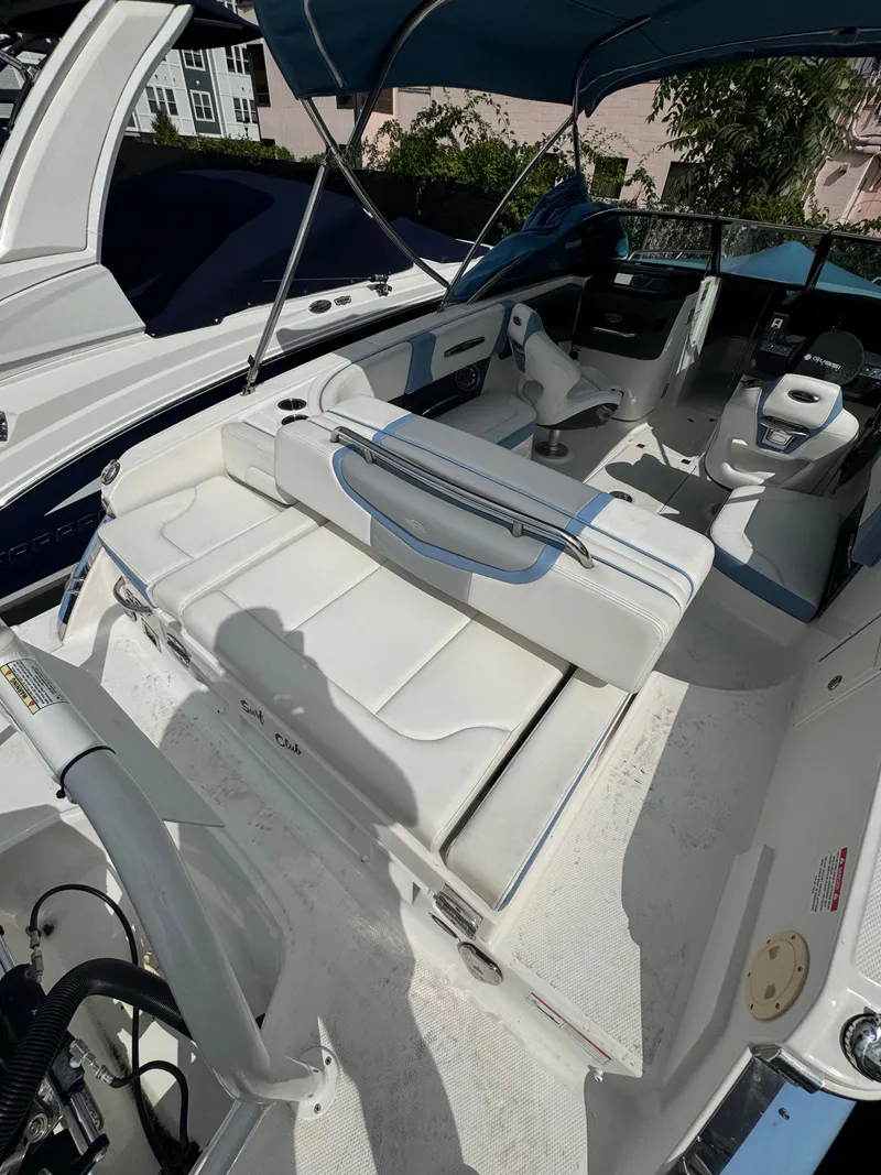 Slide: The Image of 2022 Chaparral 267 SSX OB boat interior with white seating and blue accents. - 17