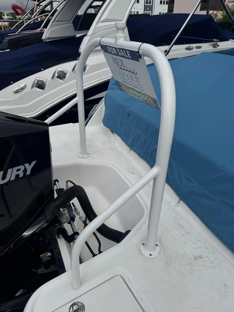 Slide: The Image of 2022 Chaparral 267 SSX OB boat for sale, covered and docked. - 8