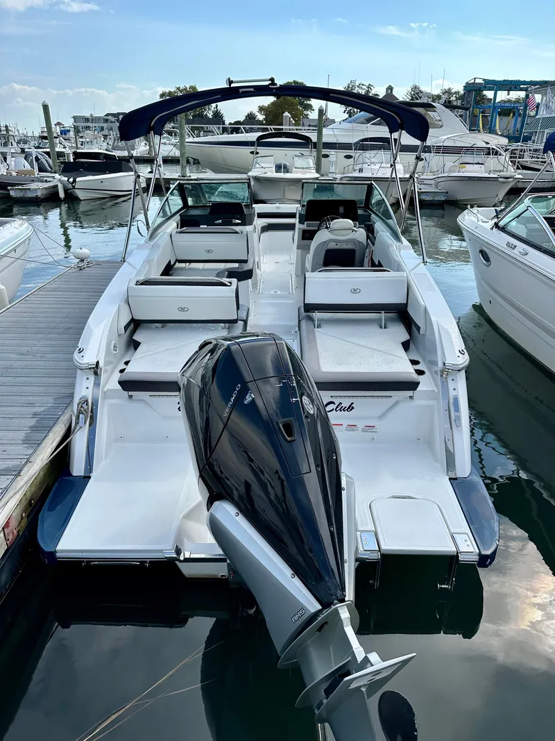 Slide: The Image of 2022 Cobalt R6 Outboard boat docked in marina, rear view. - 2