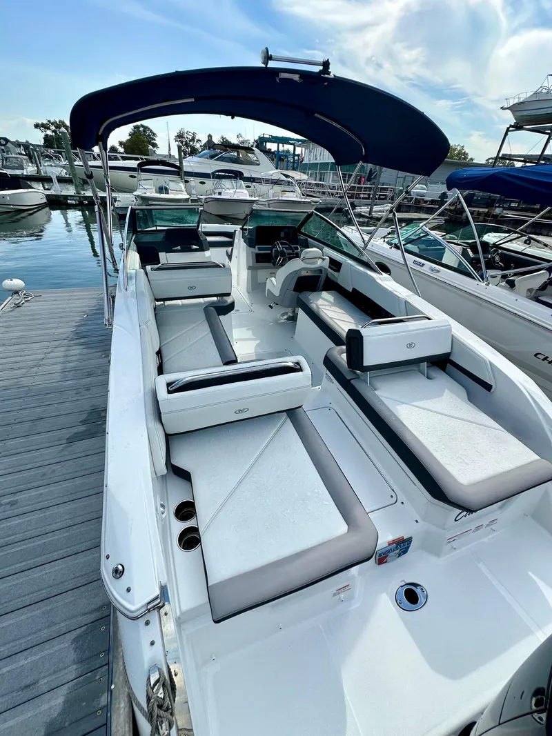 Slide: The Image of 2022 Cobalt R6 Outboard boat with spacious seating, docked at a marina. - 3