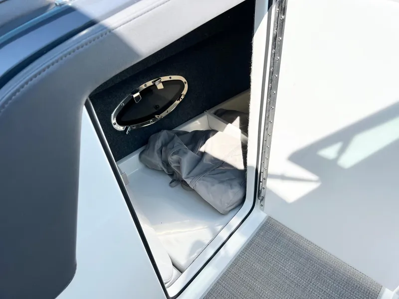 Slide: The Image of 2018 Formula 330 CRB storage compartment with gray fabric inside. - 16