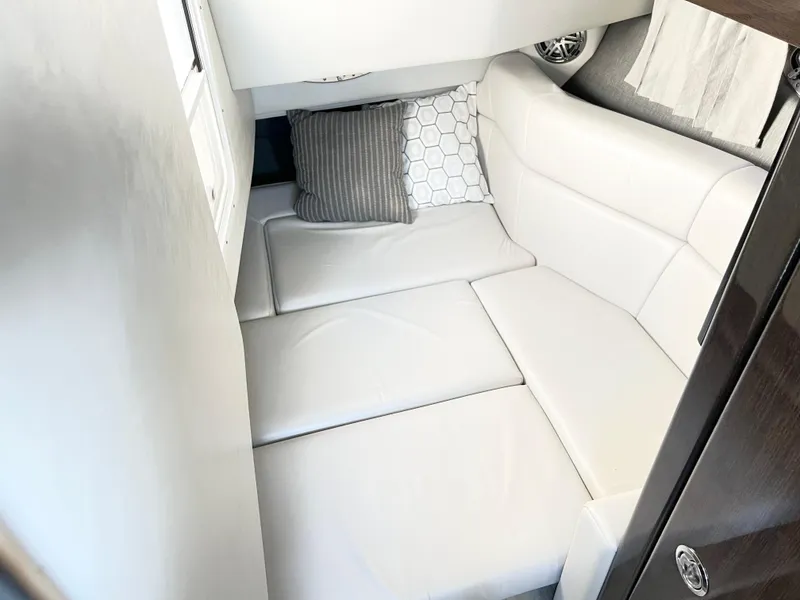 Slide: The Image of 2018 Formula 330 CRB cabin interior with white seating and decorative pillows. - 19