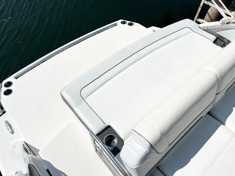Slide: The Image of 2018 Formula 330 CRB boat with white cushioned seating and sleek design. - 6