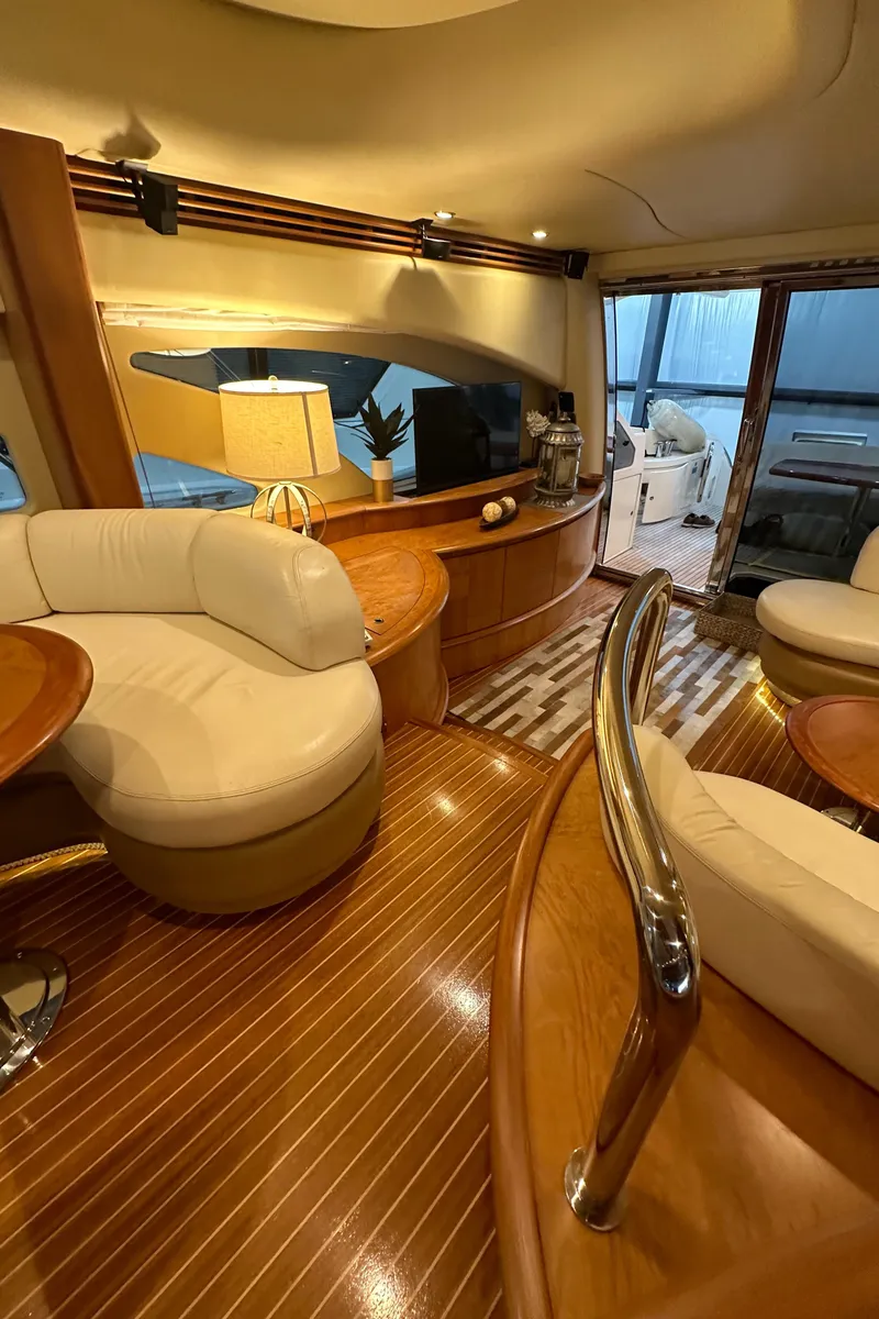 Slide: The Image of Luxurious interior of a 2011 Azimut 62E yacht with elegant wood and leather furnishings. - 15