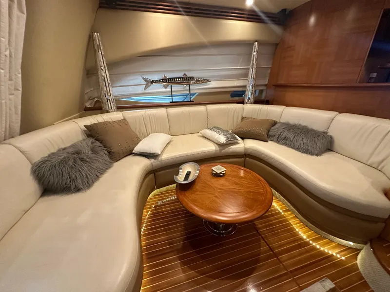 Slide: The Image of Luxurious interior of a 2011 Azimut 62E yacht with plush seating and elegant decor. - 16