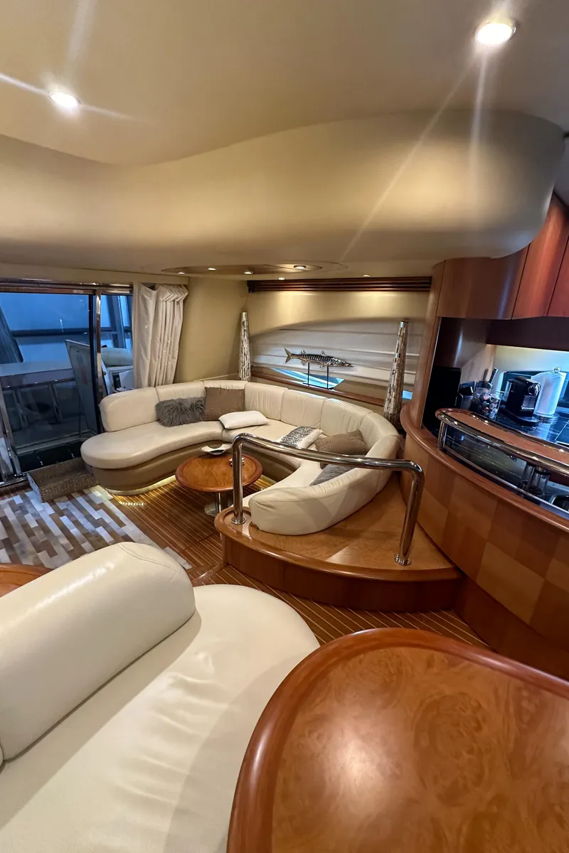 Slide: The Image of Luxurious interior of a 2011 Azimut 62E yacht with elegant seating and modern amenities. - 17