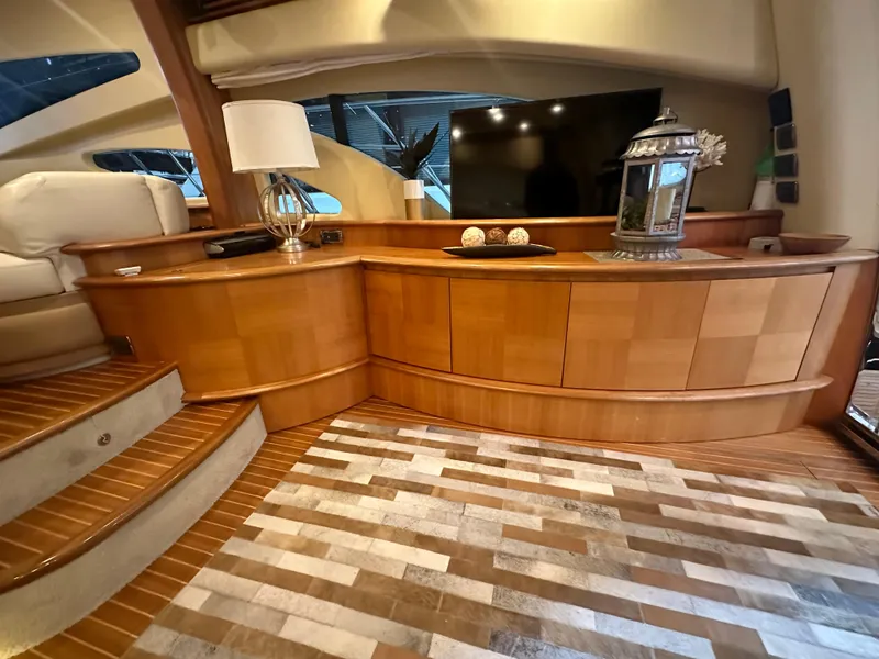 Slide: The Image of Luxurious interior of a 2011 Azimut 62E yacht with elegant wood finishes. - 18