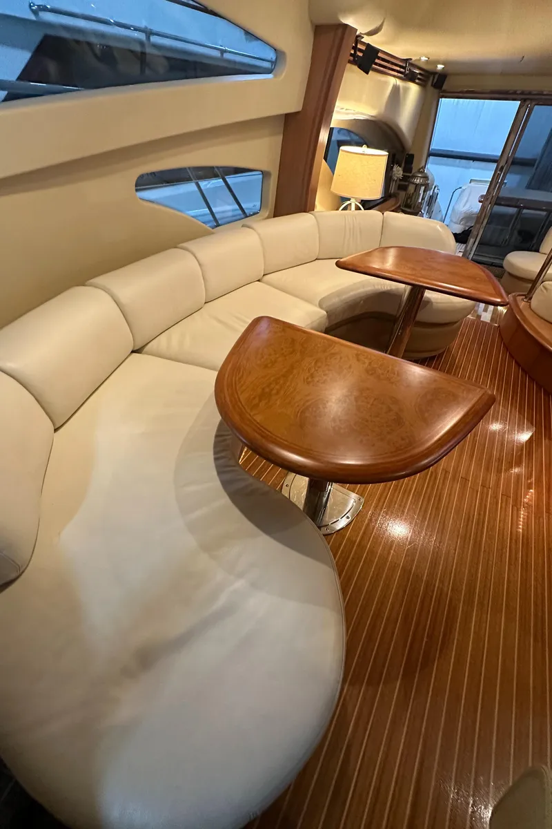 Slide: The Image of Luxurious interior of a 2011 Azimut 62E yacht with elegant seating and wooden tables. - 20