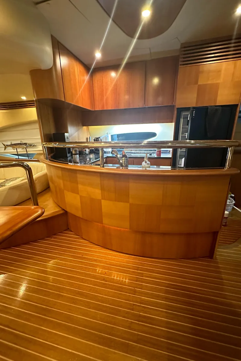 Slide: The Image of Luxurious interior of a 2011 Azimut 62E yacht with elegant wood finishes. - 21