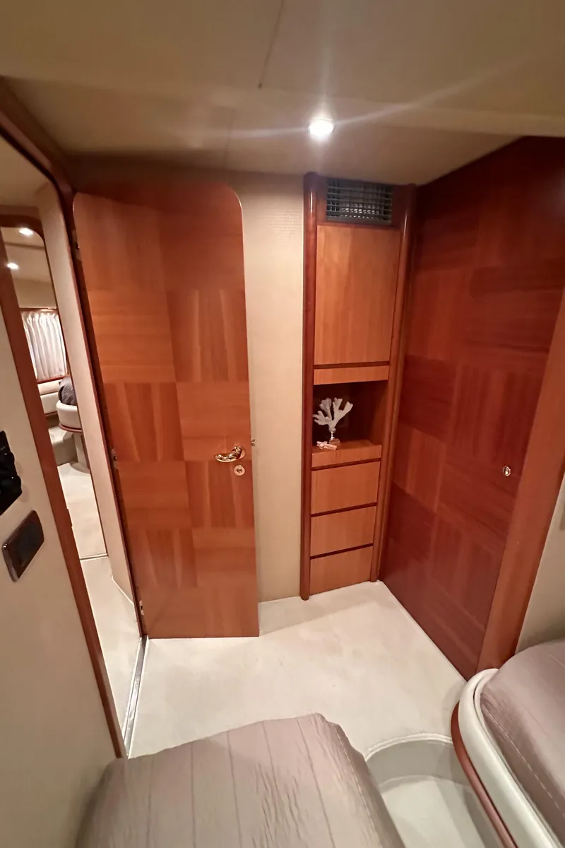 Slide: The Image of Interior of 2011 Azimut 62E yacht with wooden cabinetry and modern design. - 27