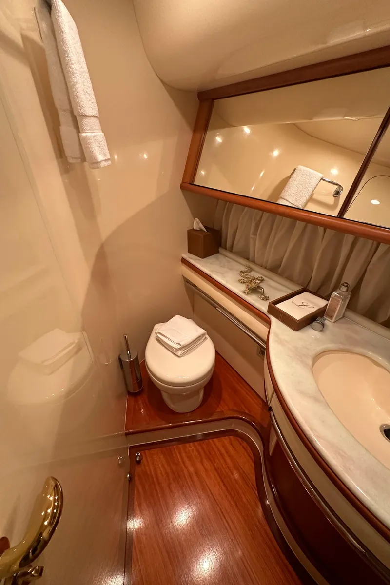 Slide: The Image of Luxurious bathroom interior of 2011 Azimut 62E yacht with elegant wood finish. - 28