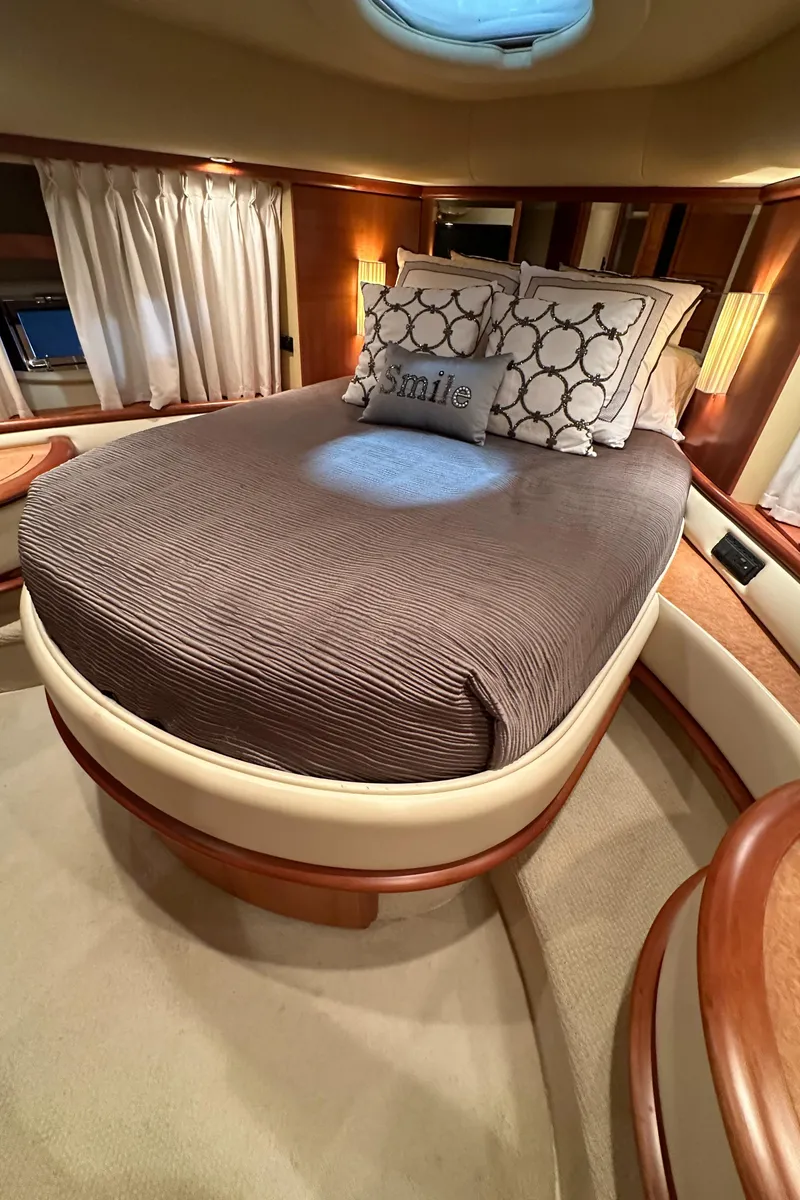 Slide: The Image of Luxurious bedroom interior of 2011 Azimut 62E yacht with elegant bedding and ambient lighting. - 31