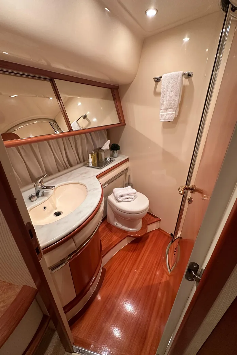 Slide: The Image of Luxurious bathroom in 2011 Azimut 62E yacht with elegant wood flooring and modern fixtures. - 35