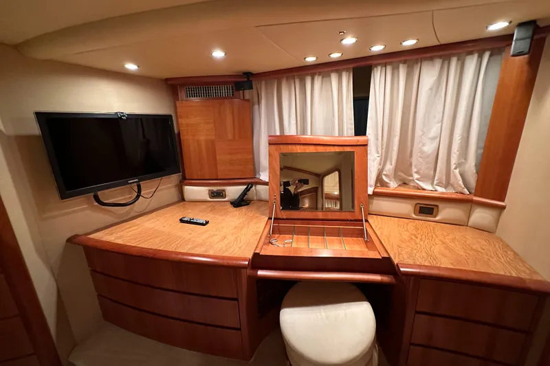 Slide: The Image of Luxurious interior of 2011 Azimut 62E yacht with TV and vanity desk. - 40