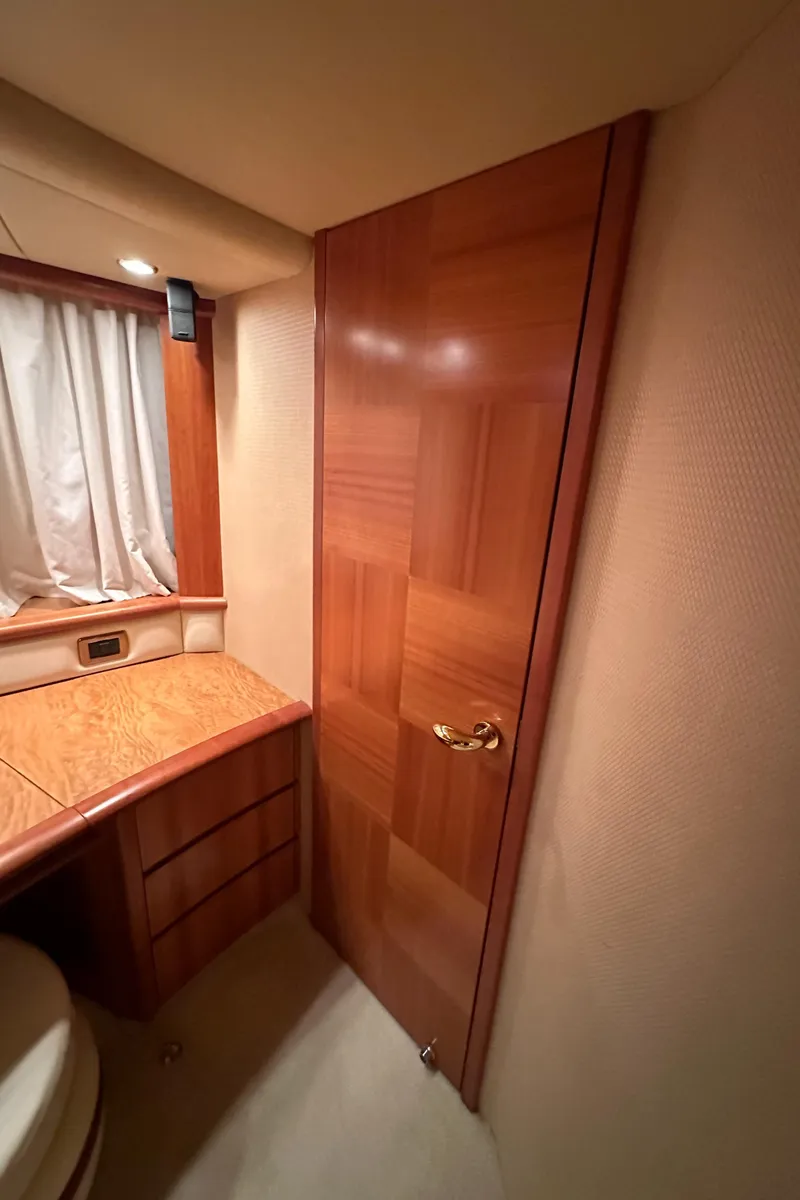 Slide: The Image of Interior of 2011 Azimut 62E yacht with wooden door and cabinetry. - 42