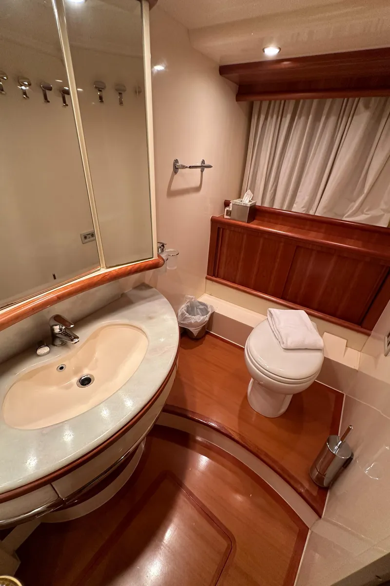 Slide: The Image of Luxurious bathroom in 2011 Azimut 62E yacht with elegant wood accents and modern fixtures. - 44