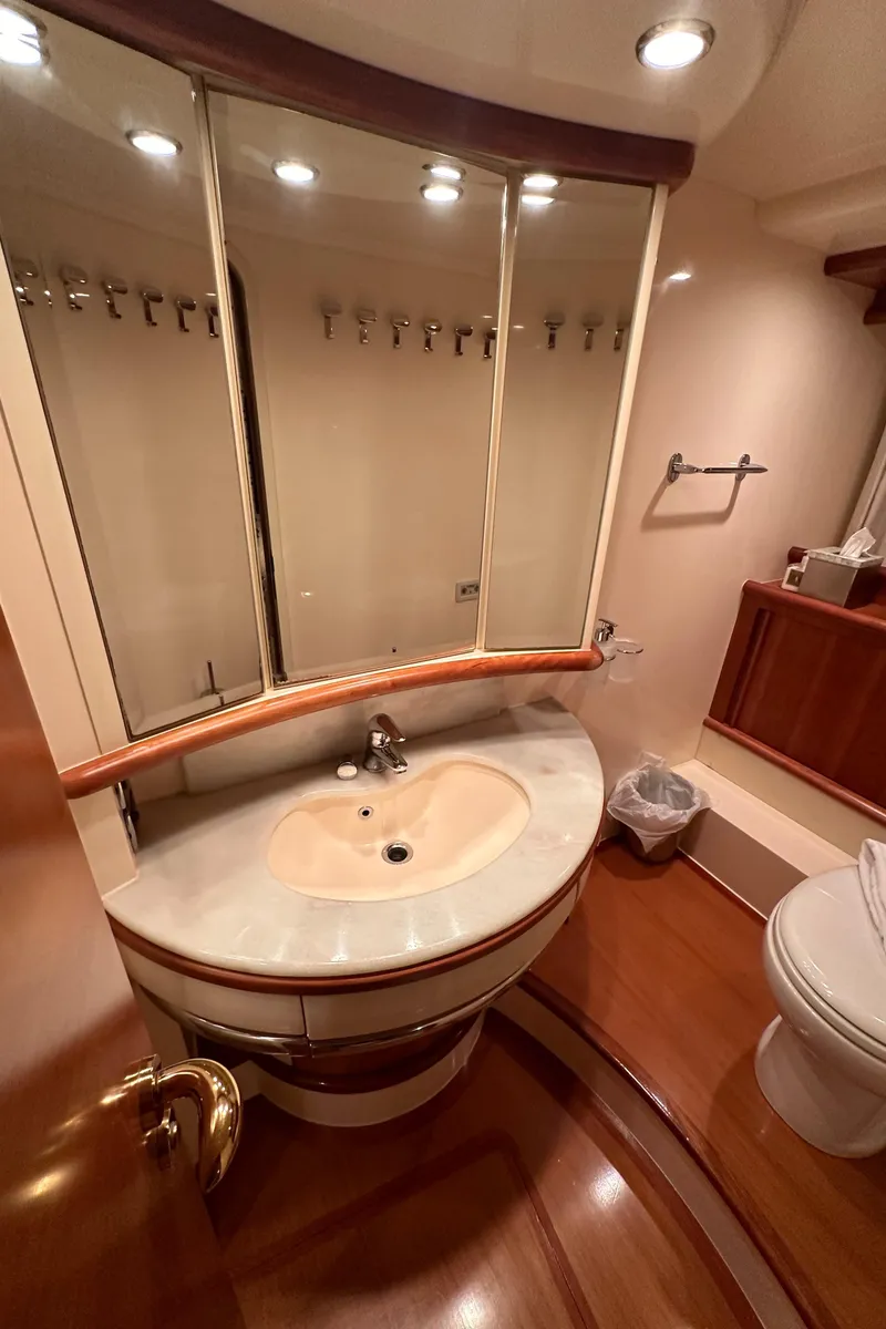Slide: The Image of Luxurious bathroom in 2011 Azimut 62E yacht with elegant fixtures and wooden accents. - 45