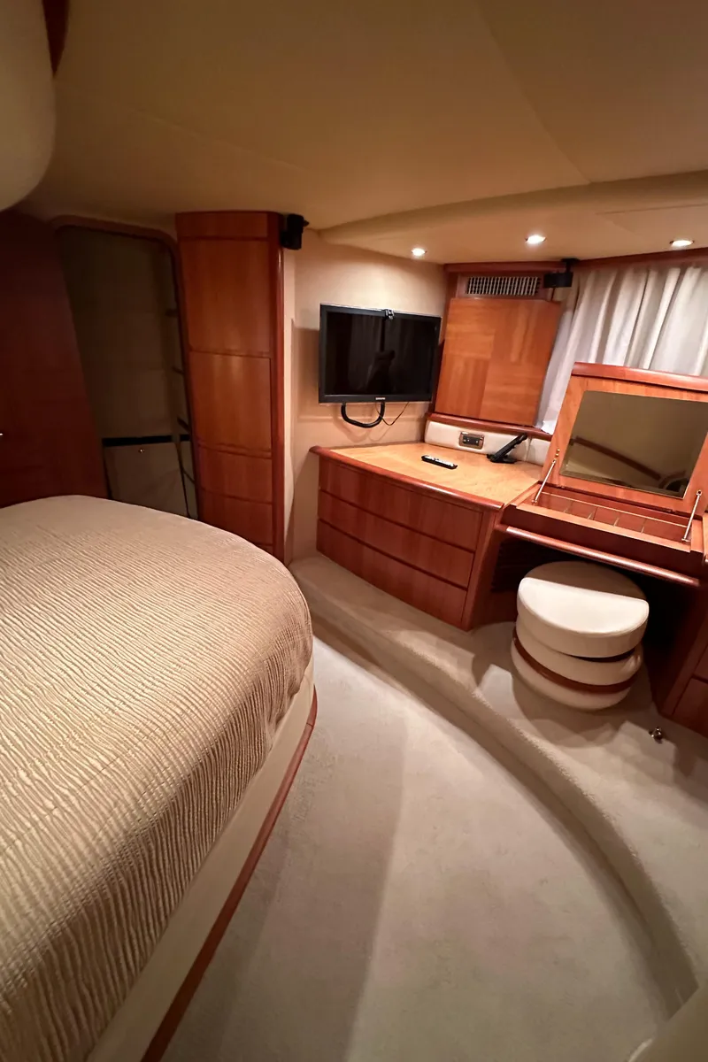 Slide: The Image of Luxurious bedroom interior of 2011 Azimut 62E yacht with TV and vanity. - 48