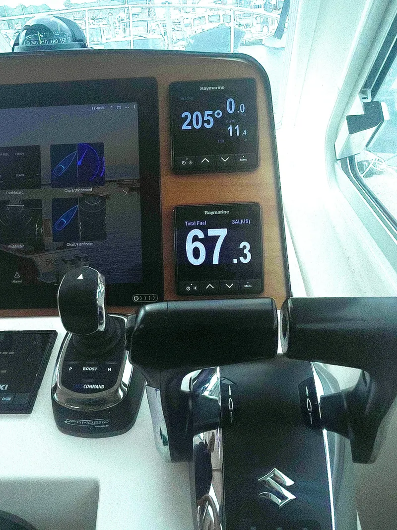 Slide: The Image of Dual Suzuki throttle controls with Raymarine Auto pilot and fuel monitor - 14