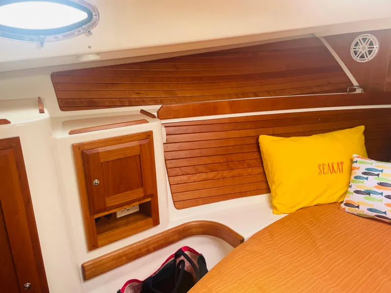 Slide: The Image of Port side Master storage with shelf above (cherry wood) - 17