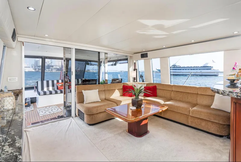 Slide: The Image of Luxurious interior of 1998 Pacific Mariner 65 Motoryacht with spacious seating and ocean view. - 24
