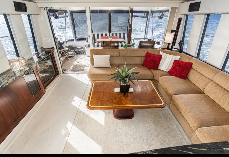 Slide: The Image of Luxurious interior of 1998 Pacific Mariner 65 Motoryacht with plush seating and elegant decor. - 25