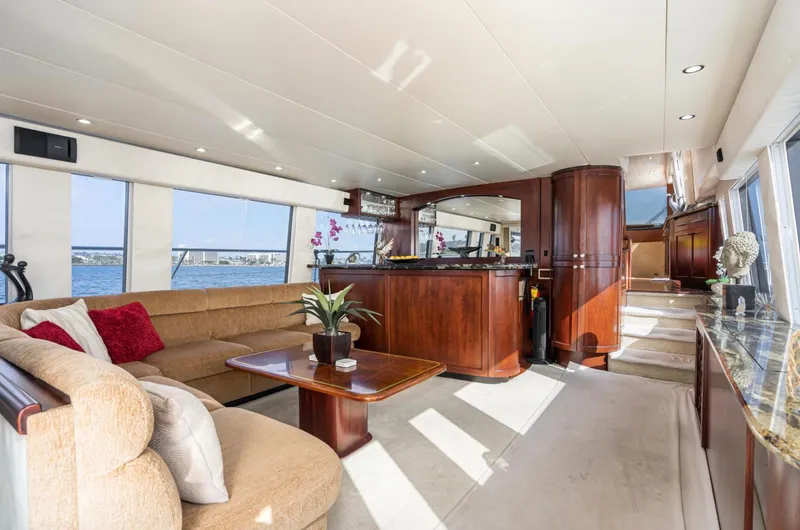 Slide: The Image of Luxurious interior of 1998 Pacific Mariner 65 Motoryacht with elegant wood finishes and plush seating. - 26