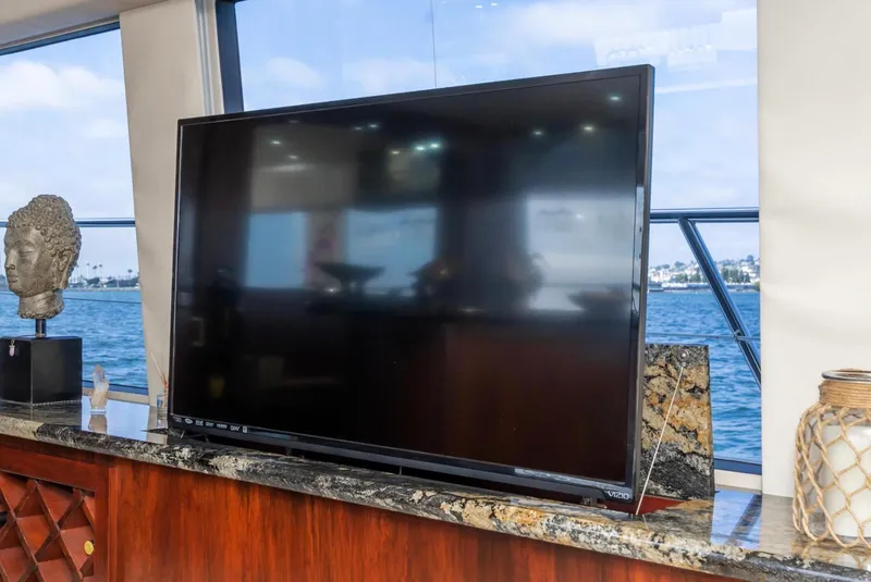 Slide: The Image of Flat-screen TV on Pacific Mariner 65 Motoryacht, 1998, with ocean view background. - 27