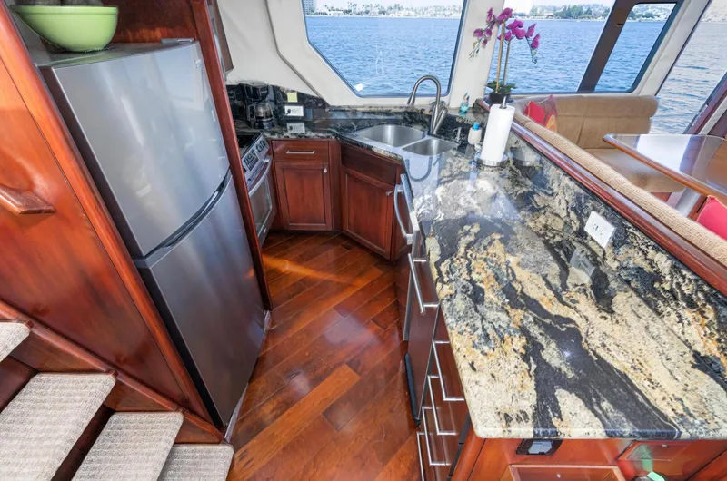 Slide: The Image of Luxurious kitchen interior of 1998 Pacific Mariner 65 Motoryacht with granite countertops. - 31