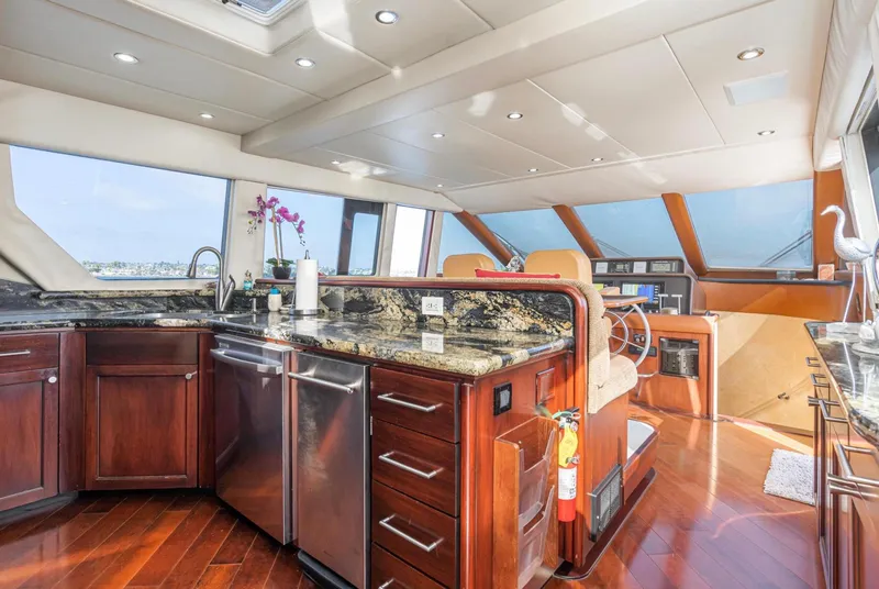 Slide: The Image of Luxurious interior of 1998 Pacific Mariner 65 Motoryacht with modern kitchen and helm. - 32