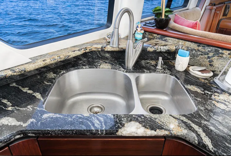 Slide: The Image of Luxurious kitchen sink on 1998 Pacific Mariner 65 Motoryacht with ocean view. - 34