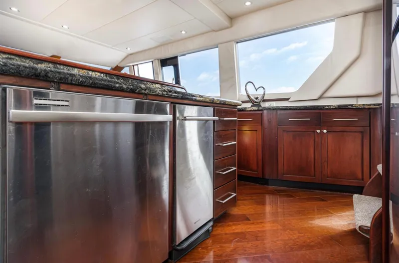 Slide: The Image of Luxurious kitchen interior of 1998 Pacific Mariner 65 Motoryacht with stainless steel appliances. - 35