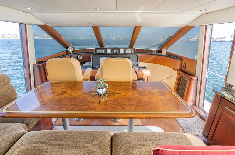 Slide: The Image of Interior of 1998 Pacific Mariner 65 Motoryacht with elegant wood table and helm view. - 36