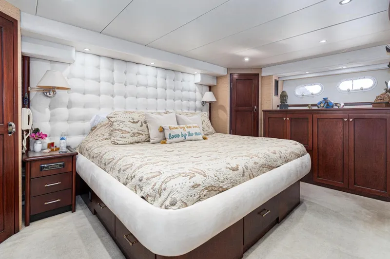 Slide: The Image of Luxurious bedroom interior of 1998 Pacific Mariner 65 Motoryacht with elegant decor and plush bedding. - 49