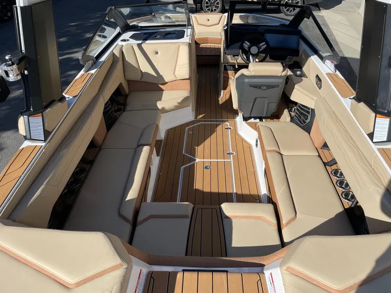 Slide: The Image of 2025 Nautique Super Air Nautique G23 interior with luxurious seating and sleek design. - 5