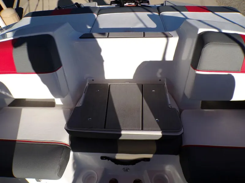 Slide: The Image of 2025 Tahoe T21 boat interior with cushioned seating and storage area. - 10