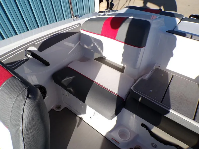 Slide: The Image of 2025 Tahoe T21 boat interior with red and gray seating. - 13