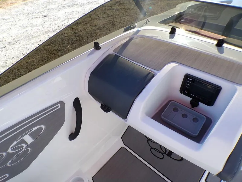 Slide: The Image of 2025 Tahoe T21 boat interior with dashboard and seating area. - 18