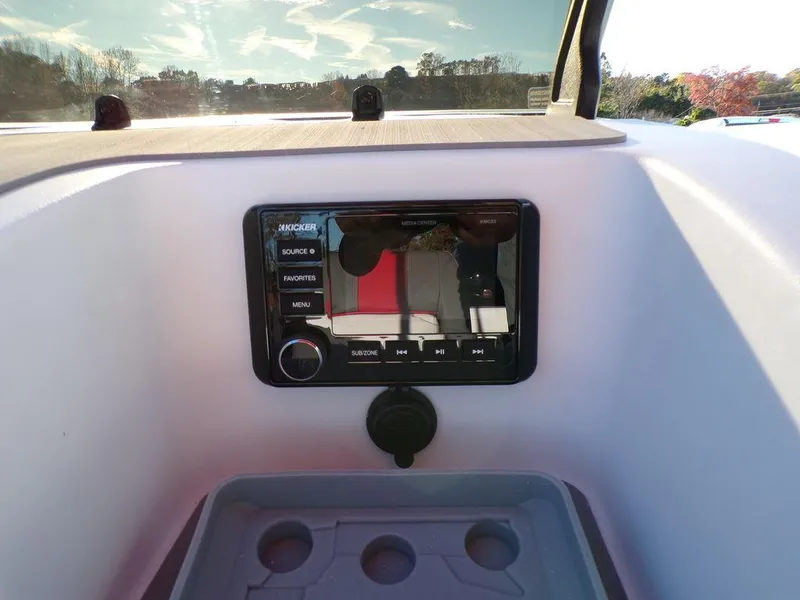 Slide: The Image of 2025 Tahoe T21 dashboard with modern audio system and cup holders. - 20