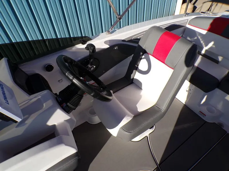 Slide: The Image of 2025 Tahoe T21 boat interior with steering wheel and seating. - 21
