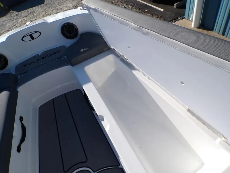 Slide: The Image of 2025 Tahoe T21 boat interior with open storage compartment. - 22