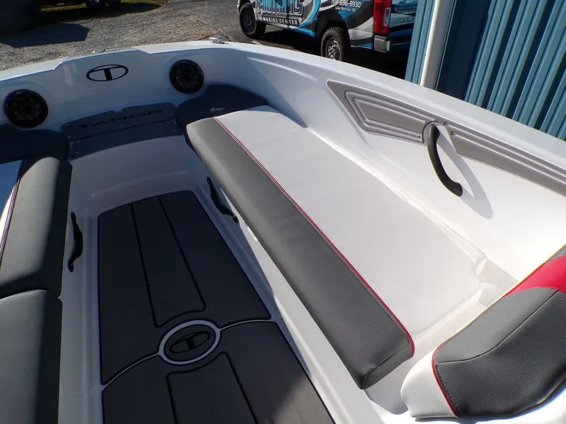 Slide: The Image of 2025 Tahoe T21 boat interior with gray and white seating, modern design. - 23