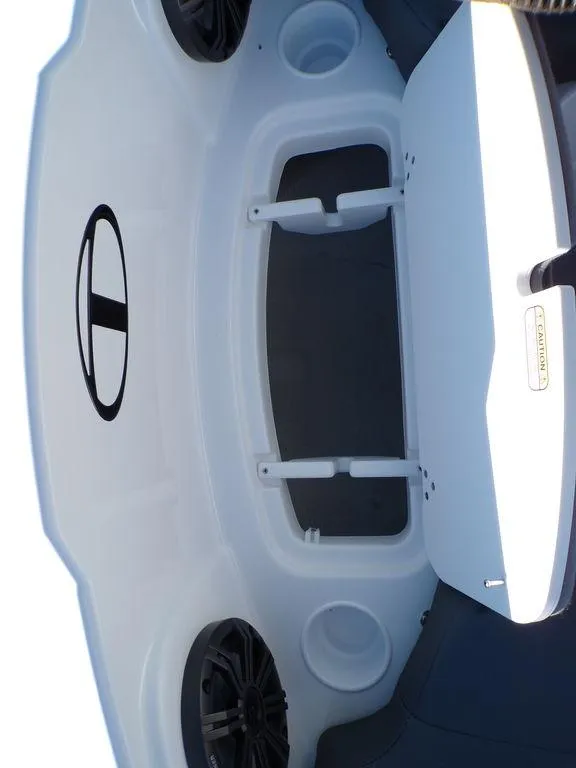 Slide: The Image of 2025 Tahoe T21 boat interior with storage compartments and speakers. - 24