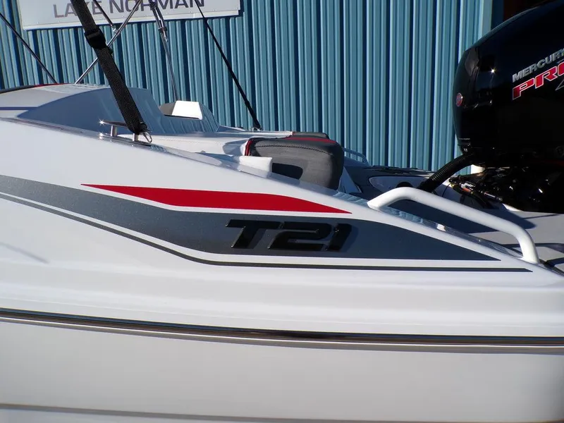 Slide: The Image of 2025 Tahoe T21 boat with sleek design and Mercury engine. - 4