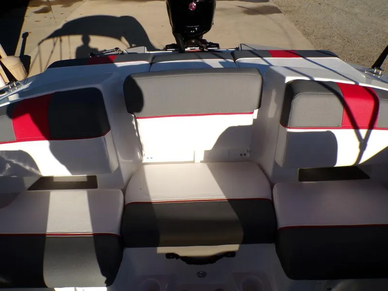 Slide: The Image of 2025 Tahoe T21 boat interior with gray and red seating. - 9