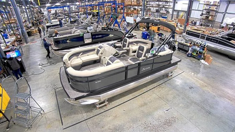 Slide: The Image of 2022 Barletta C20QC pontoon boat in a manufacturing facility. - 0